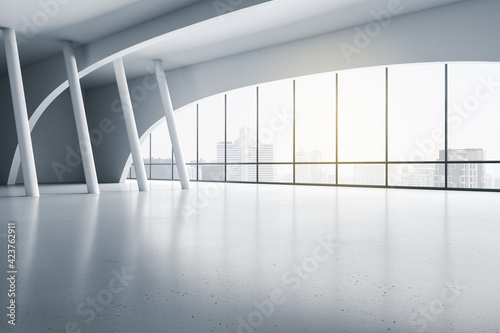 Photography Modern empty exhibition hall with white columns on glossy floor and sunny city view from transparent wall