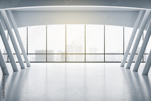 Sunny stylish empty presentation hall with city skyscrapers view from big window, glossy floor and white columns. 3D rendering, mock up