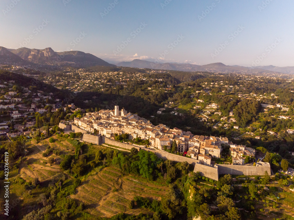 an aerial view of St Paul de Vence in France. a small old town on a mountain in the sunset 