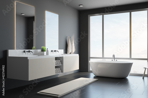 City view from big window in modern style interior design bathroom with white bath  dark wall and mirrors with sinks for two