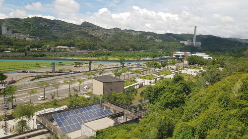 A bird's-eye view from Maokong Gondala sees mountains, roads and electric train lines. Taipei, Taiwan. photo