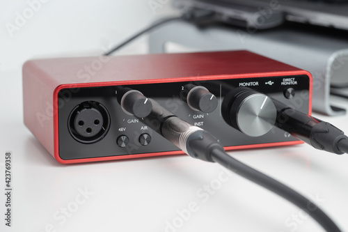 Close up modern Audio Interface With Cables Plugged in