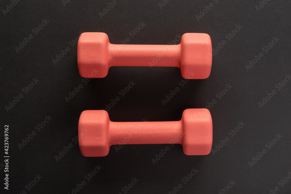 Dumbbells on black background. Fitness, sport, workout flatlay Dumbbells on black background. Fitness, sport, workout flatlay