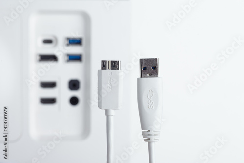 Close-up of the usb3 cable. The monitor's built-in USB hub as a backgound