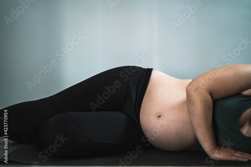 Pregnant woman doing pilates