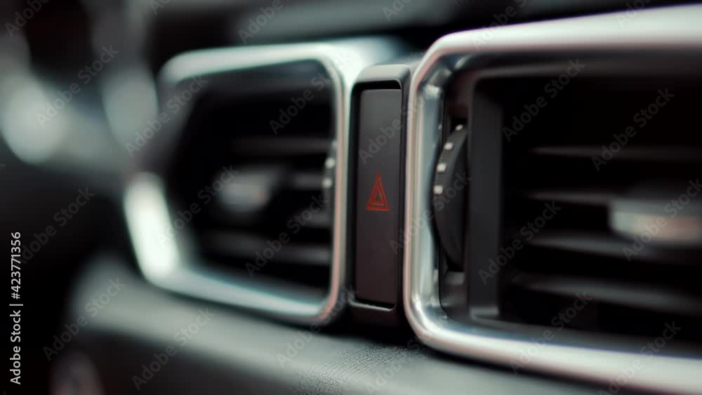 Pushing Car Hazard Emergency Lights Button. Emergency Car Warning