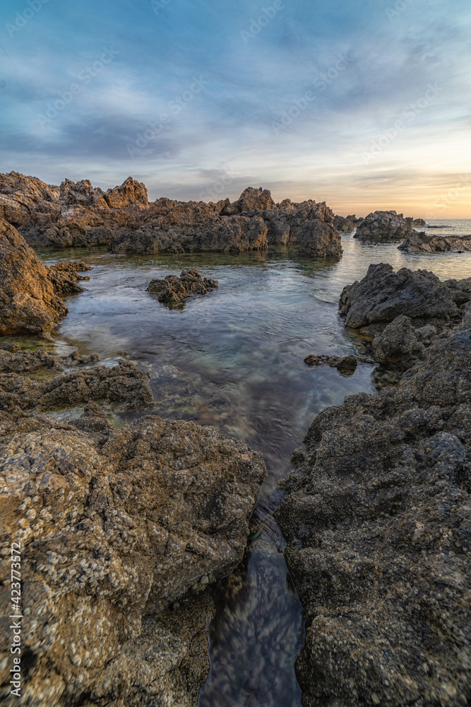 Small inlet of sea water at sunrise
