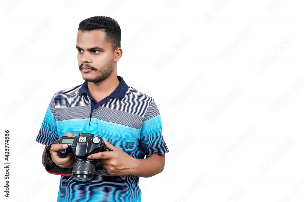Young man taking a photo with a professional camera. Front view. Over white, all angel poses Young man taking a photo with a professional camera. Front view. Over white, all angel poses