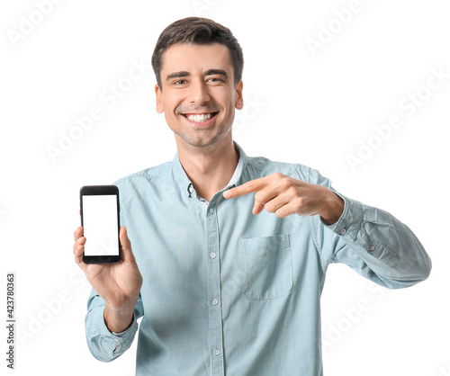 Young man with mobile phone...