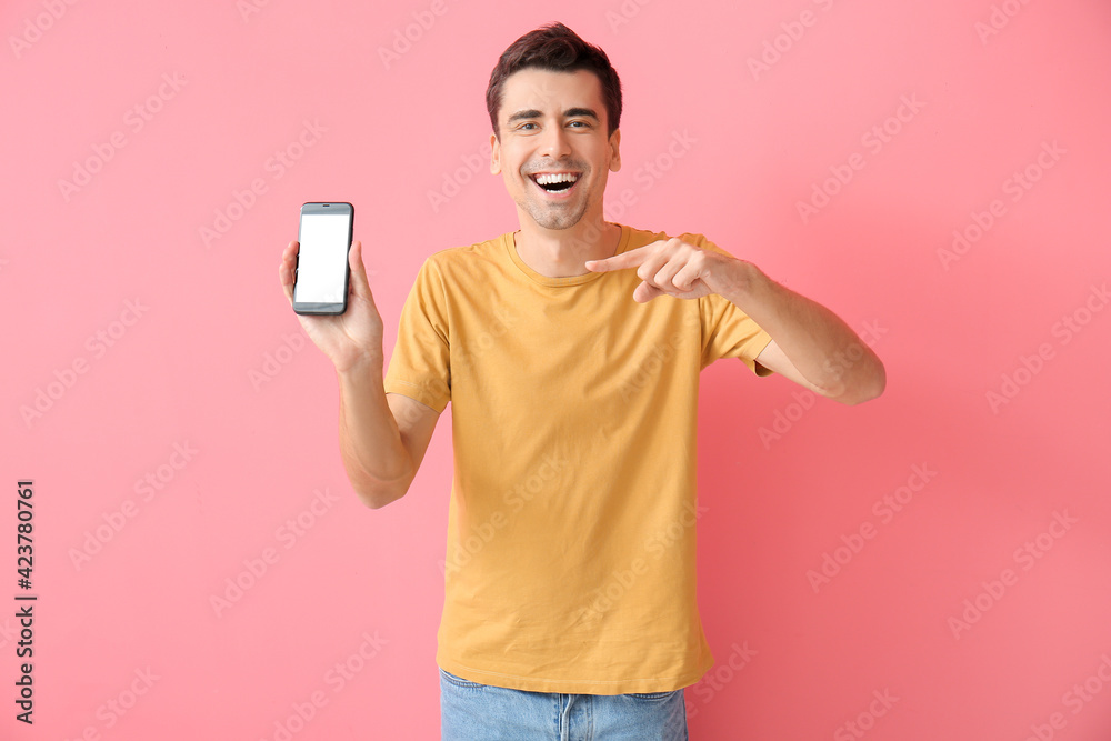Young man with mobile phone on color background Young man with mobile phone on color background