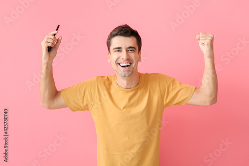 Happy man with mobile phone...