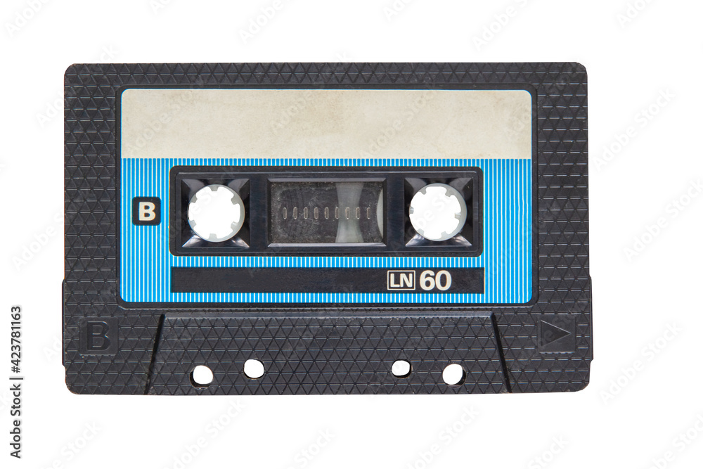 Obraz premium An old black audio tape isolated on a white background