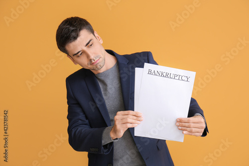 Man holding papers with wor...