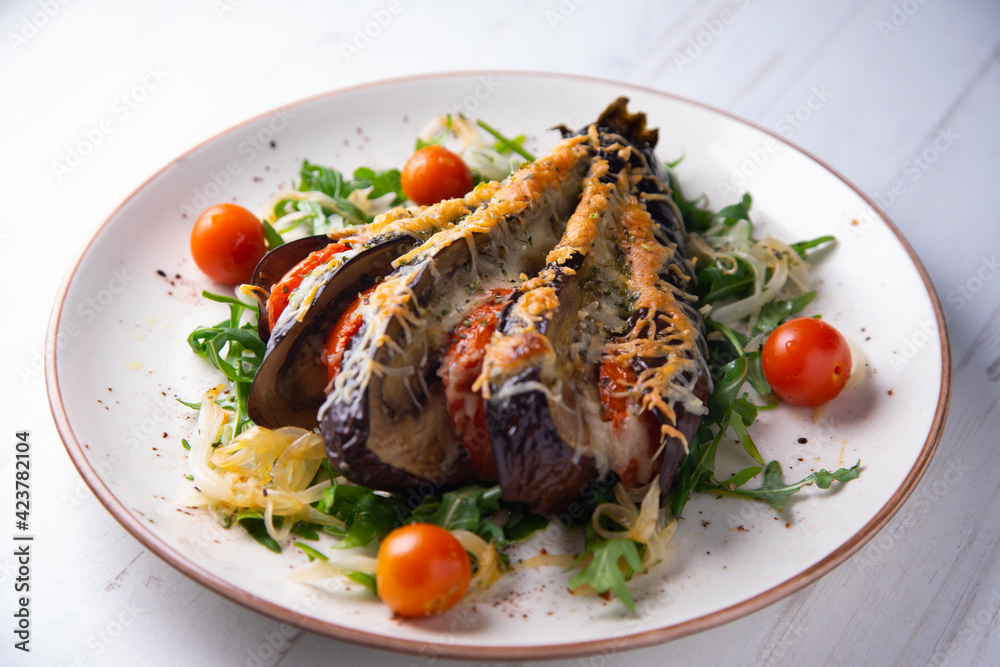 Hasselback Eggplant stuffed with tomato Italian style with cheese Hasselback Eggplant stuffed with tomato Italian style with cheese