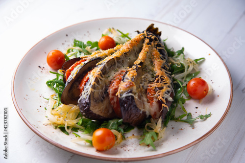 Hasselback Eggplant stuffed with tomato Italian style with cheese