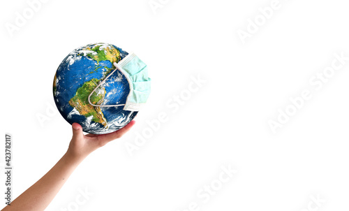 Earth Day concept  hand holding earth globe with a face mask  isolated on a white background.  Elements of this image furnished by NASA 