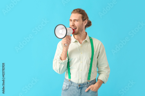 Young man with megaphone on...
