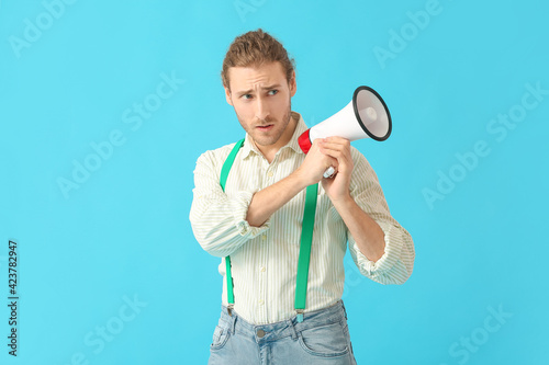 Young man with megaphone on...