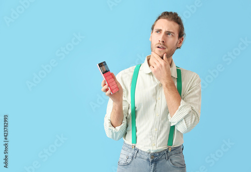 Thoughtful man with calcula...