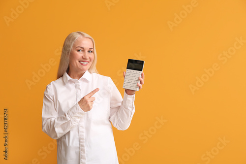 Mature woman with calculato...