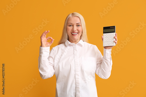 Mature woman with calculato...