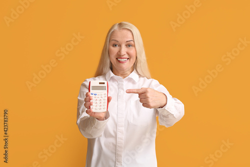 Mature woman with calculato...