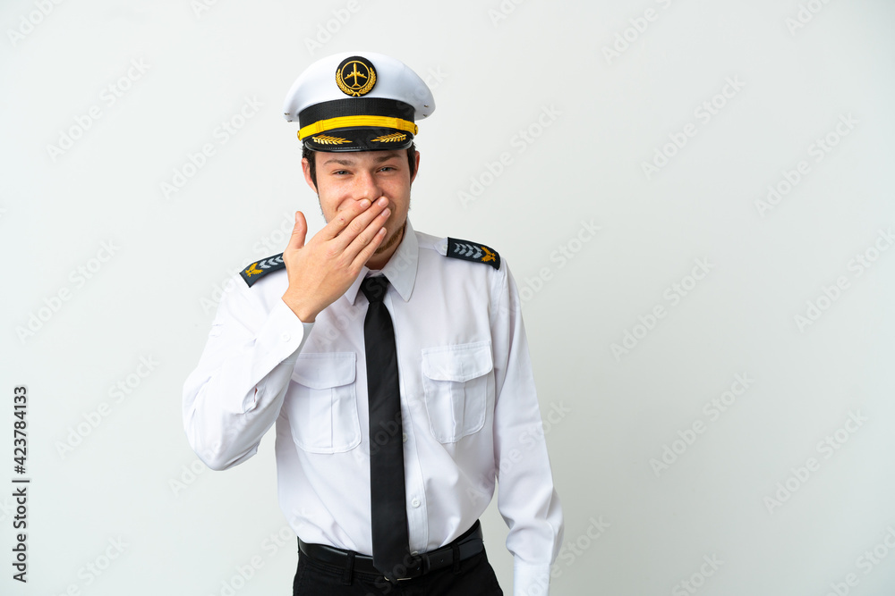 Airplane Russian pilot isolated on white background happy and smiling covering mouth with hand Airplane Russian pilot isolated on white background happy and smiling covering mouth with hand
