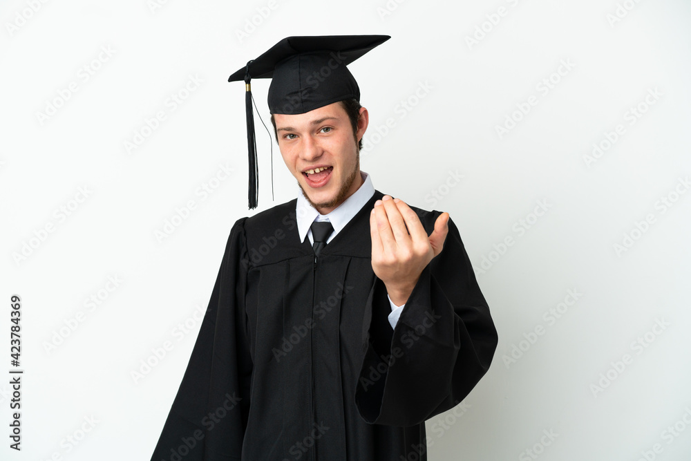 Young university Russian graduate isolated on white background inviting to come with hand. Happy that you came Young university Russian graduate isolated on white background inviting to come with hand. Happy that you came