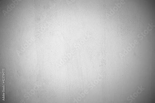 The white concrete stone. concrete plastered stucco wall painted. white grunge cement or concrete painted wall texture. The cement wall background abstract gray concrete texture for interior design.