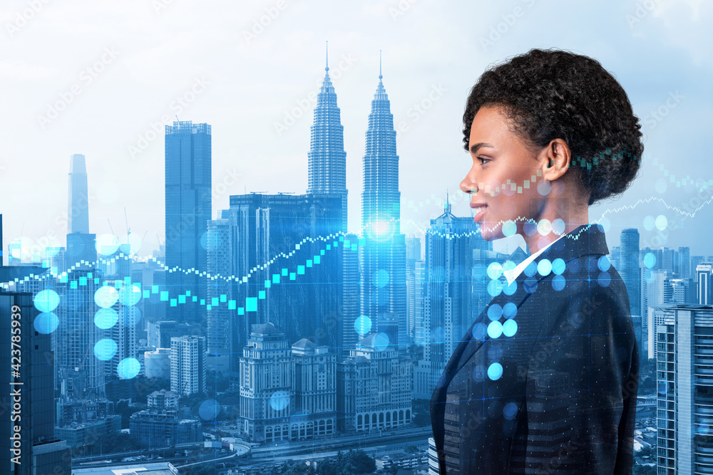 Attractive black woman trader and stock market analyst in suit dreaming about market behavior and forecast in crisis. Women in business concept. Forex chart. Kuala Lumpur. Double exposure. Attractive black woman trader and stock market analyst in suit dreaming about market behavior and forecast in crisis. Women in business concept. Forex chart. Kuala Lumpur. Double exposure.