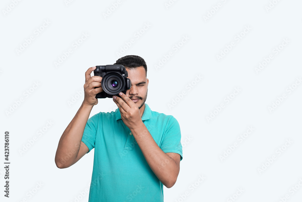 man with a professional DSLR camera, showing thumbs up, checking photos, showing the camera, operating the camera, with a blank white plate man with a professional DSLR camera, showing thumbs up, checking photos, showing the camera, operating the camera, with a blank white plate