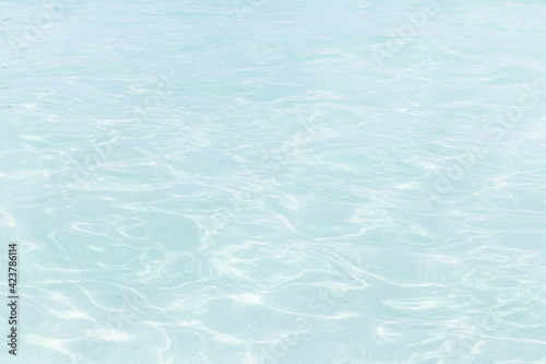 Shining blue water ripple background 