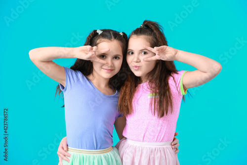 Portrait of cute twin girls...
