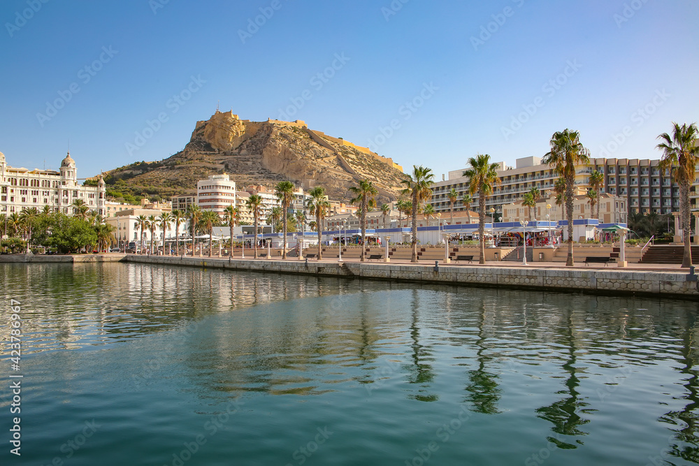 Waterfront and marina of the seaside city with Mount Benacantil, and the Castle of Santa Barbara in the background, Alicante, Costa Blanca, Spain.