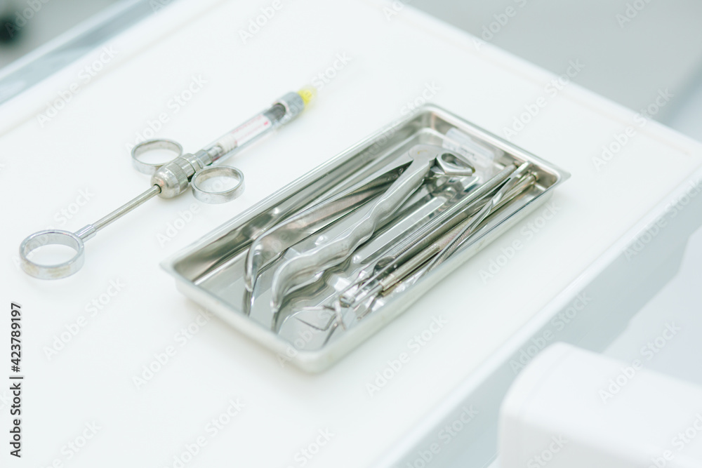 Set of tools on the white table without people near Set of tools on the white table without people near