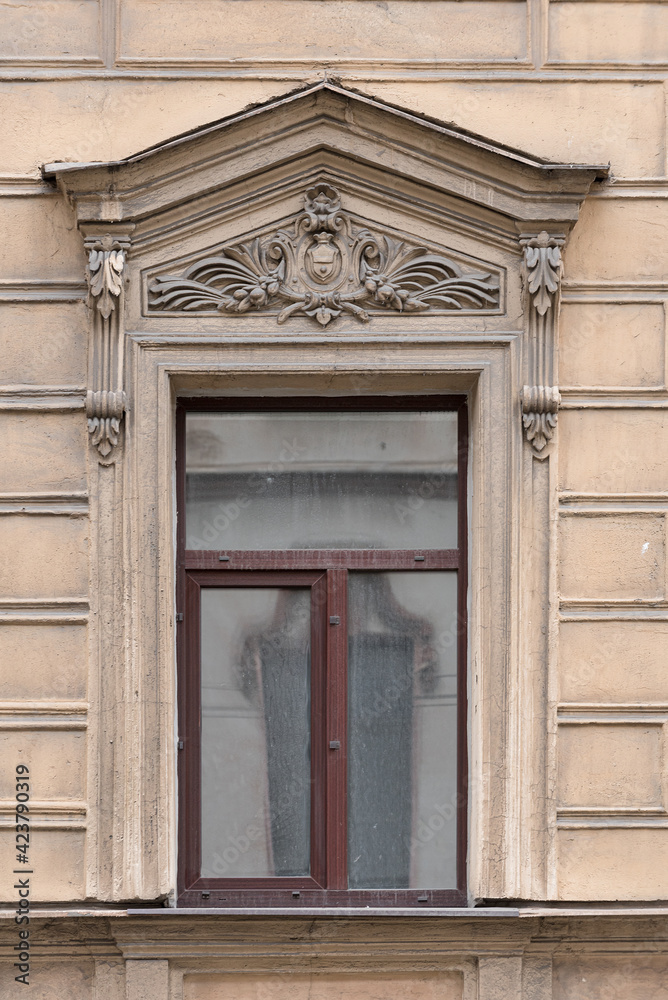 Windows in the city in the old style, with stucco, decorative elements