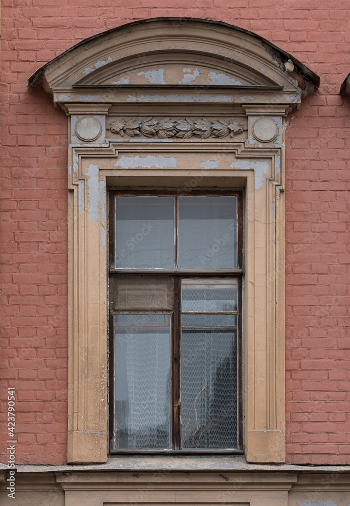 Windows in the city in the old style, with stucco, decorative elements Windows in the city in the old style, with stucco, decorative elements