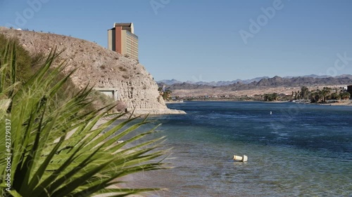 Riverfront of Colorado river, Laughlin, Nevada, USA, slow motion revealing view on sunny day photo