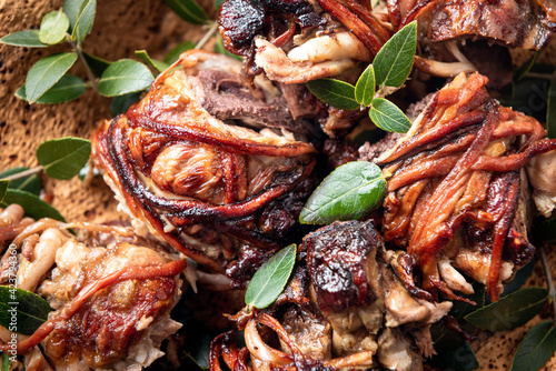 Fototapeta Naklejka Na Ścianę i Meble -  Trattalia, interiora di agnello arrostite allo spiedo, cucina della tradizione agro-pastorale sarda 