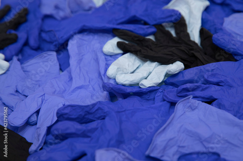 .A lot of medical gloves on a white background. Black, white, blue.medical gloves