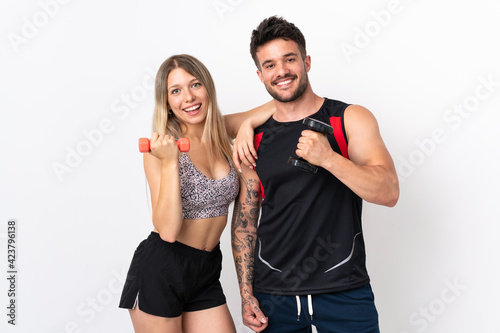 Young sport couple isolated on white background