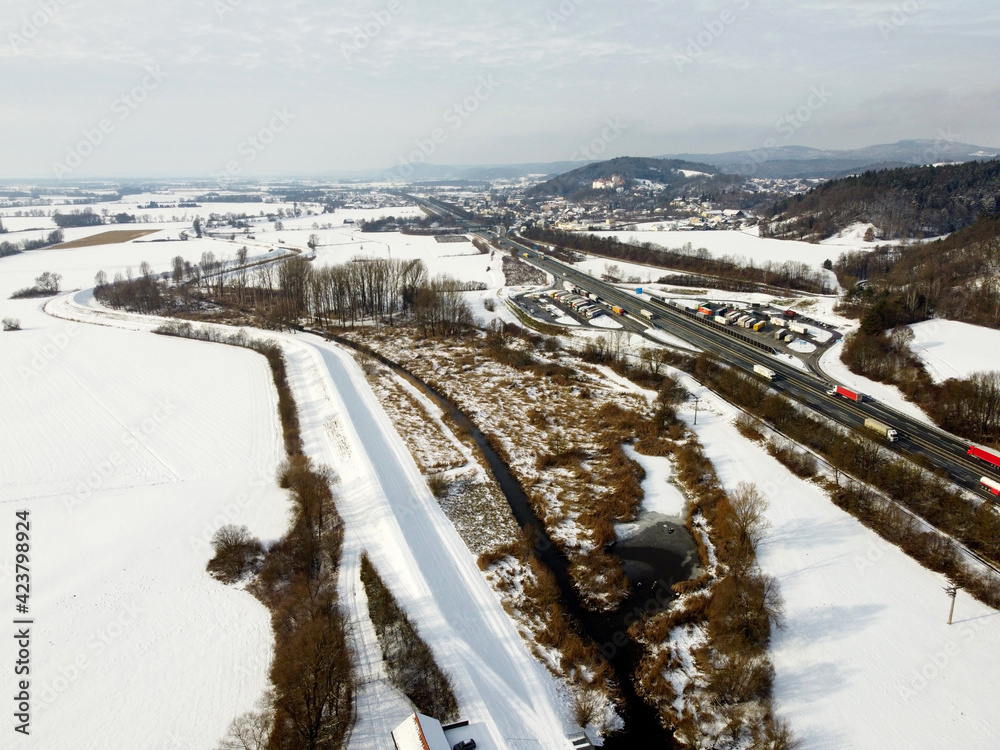 Obraz premium Aerial shots of a country road in Bavaria in winter