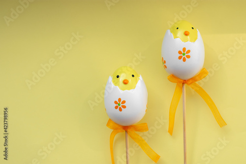 Easter eggs on yellow pastel background happy spring vibe celebrate holiday