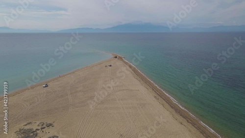 4k sideways moving clip over a peninsula on  the tropical beach of Epanomi, Halkidiki, Greece photo