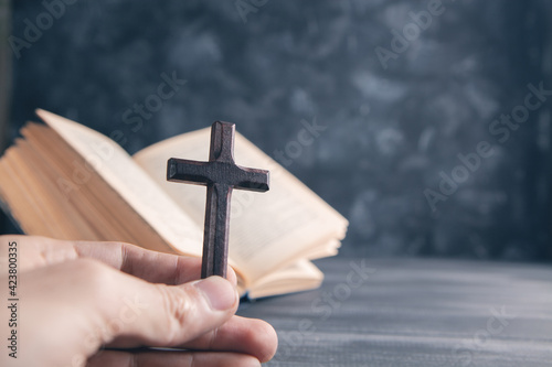 wooden cross on the book