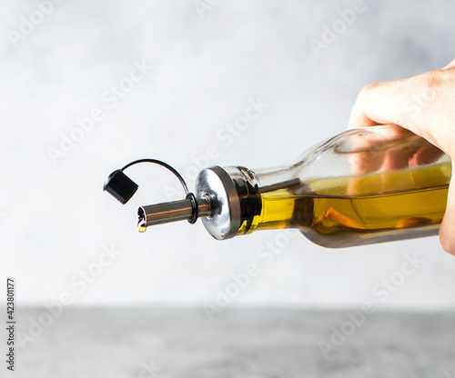 a bottle of olive oil drips