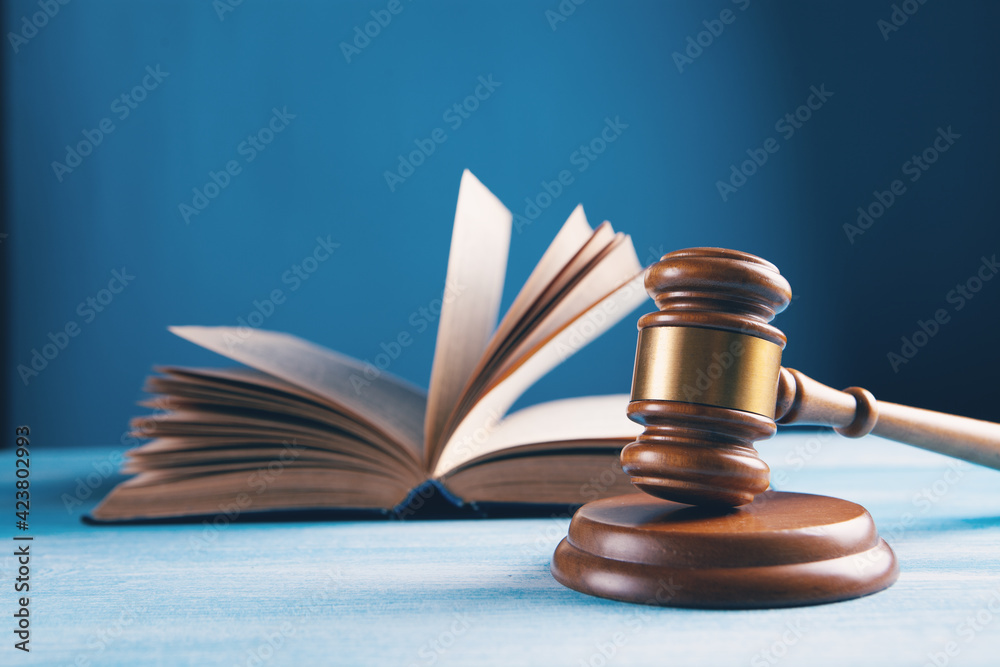 judge gavel with book on wooden background