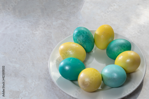 Easter eggs on the plate. Spring season. Easter composition of eggs. Orthodox tradition.