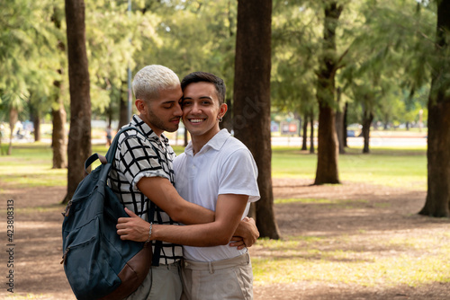 Gay couple embracing in a public park © Spectral-Design