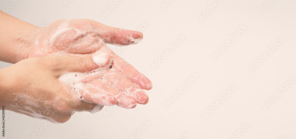 Hands washing gesture with foaming hand soap on white background. Hands washing gesture with foaming hand soap on white background.
